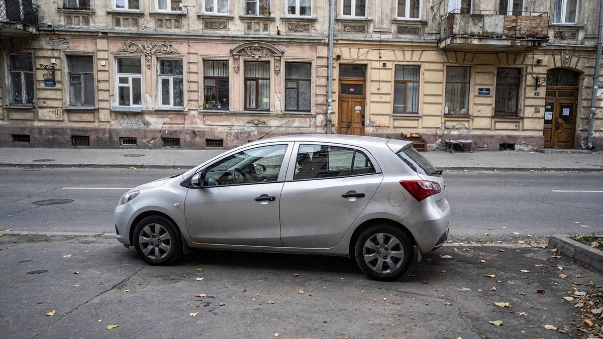 Compact rental car parked on a street in central Kyiv